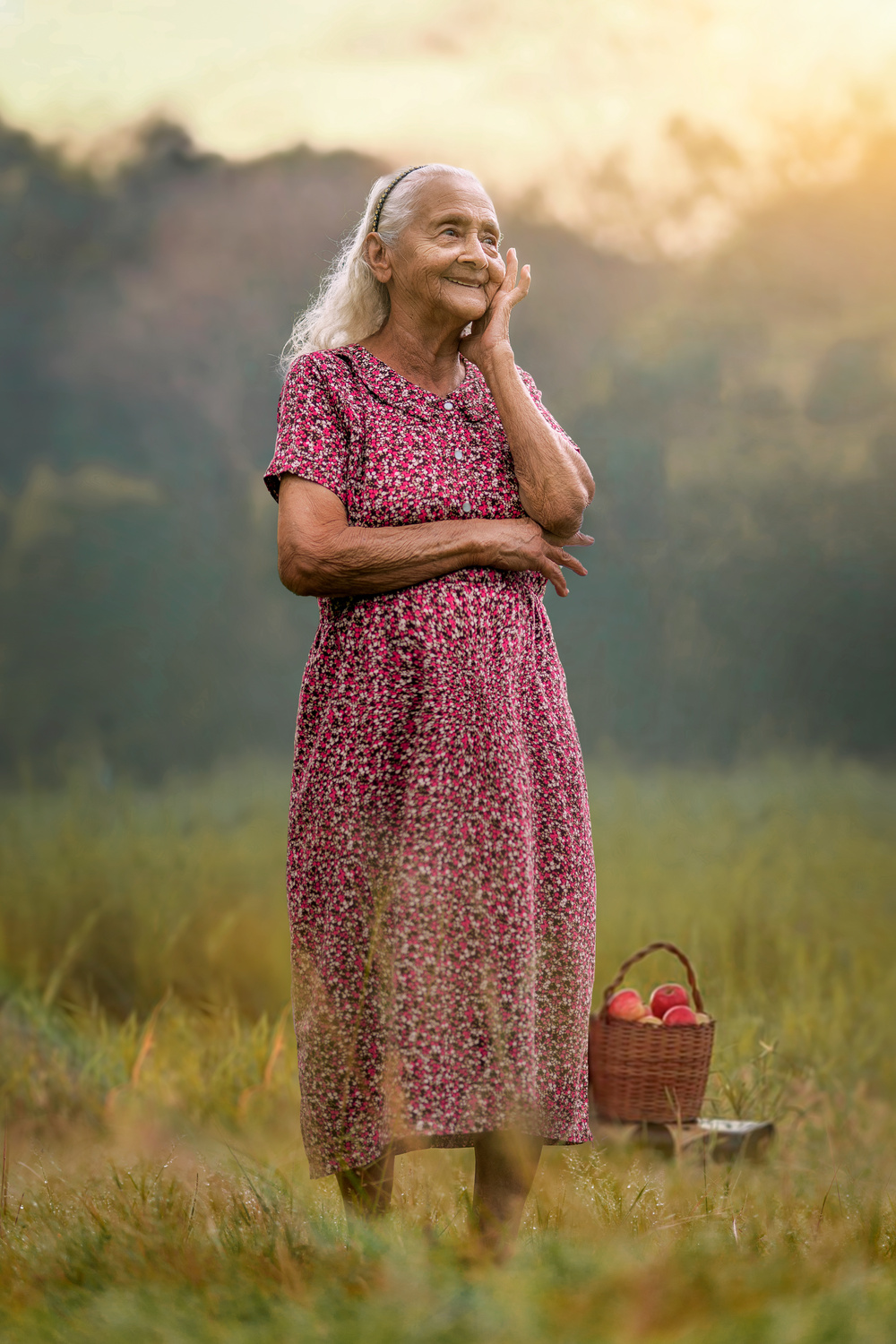 Elderly Woman in Floral Dress Standing in the Field